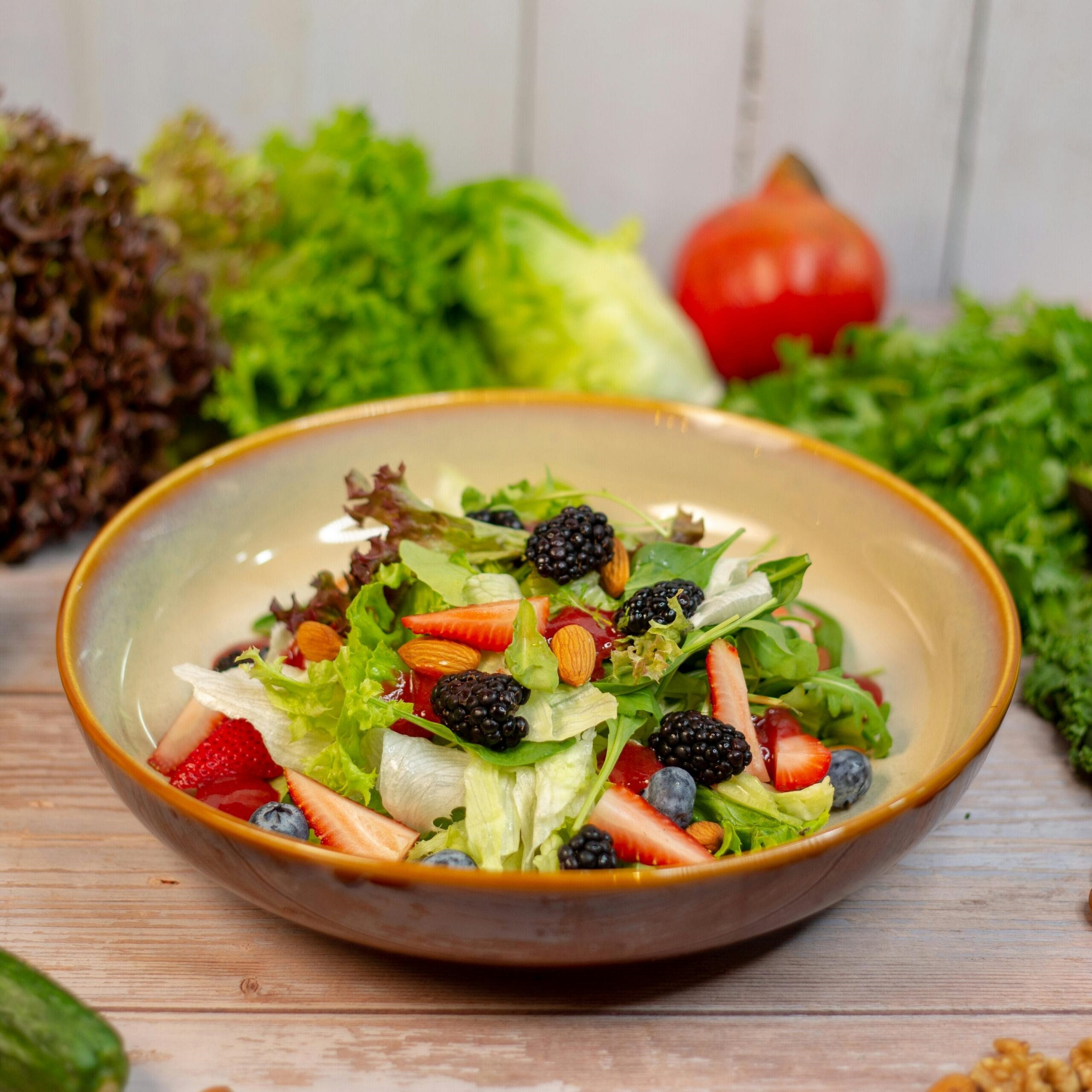 Fresh ingredients for Chick-fil-A kale salad including kale, shredded carrots, red cabbage, almonds, and feta cheese
